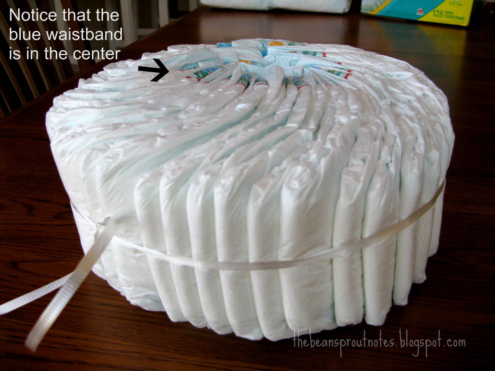 Where can you find instructions for a two-tier diaper cake for twins?